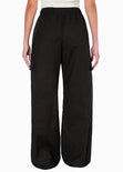 Pantalón ancho tipo lino con bolsillos cargo, elástico en cintura y anudado color negro para mujer - Flashy