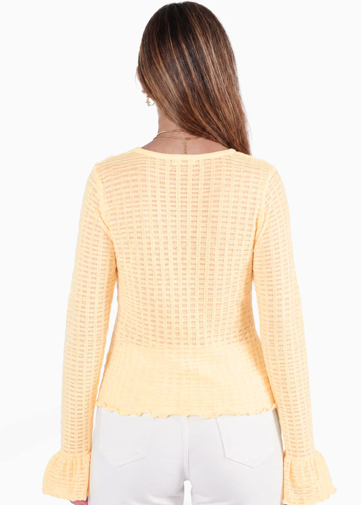 Blusa manga larga con botones de color amarillo - TERESINA