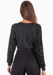 Buzo corto con mangas de lentejuelas color negro para mujer - Flashy