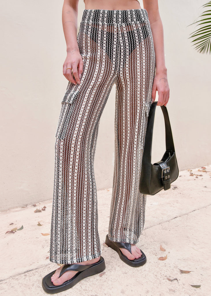 Pantalón recto de tela tipo crochet y con elástico en cintura color negro para mujer - Flashy
