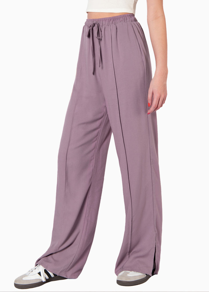 Pantalón wide leg con aberturas en frente, elástico en cintura y anudado color morado para mujer - Flashy